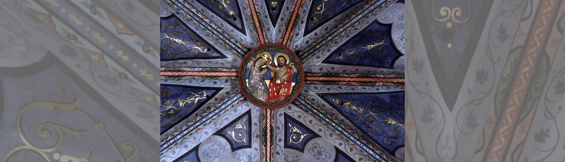 L'église Notre-Dame de la Réal  clé de voute avec 2 personnages